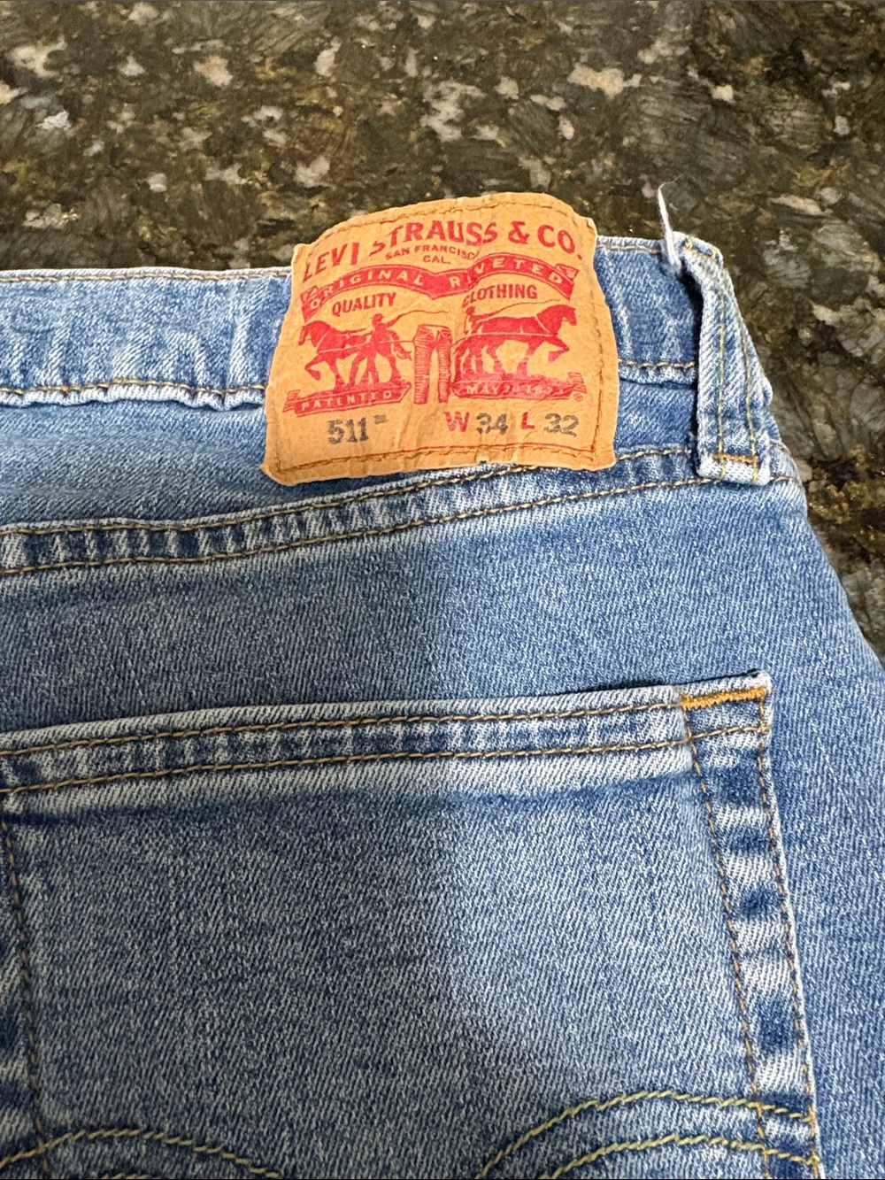 Levi's light blue denim jeans with tan patch and red logo